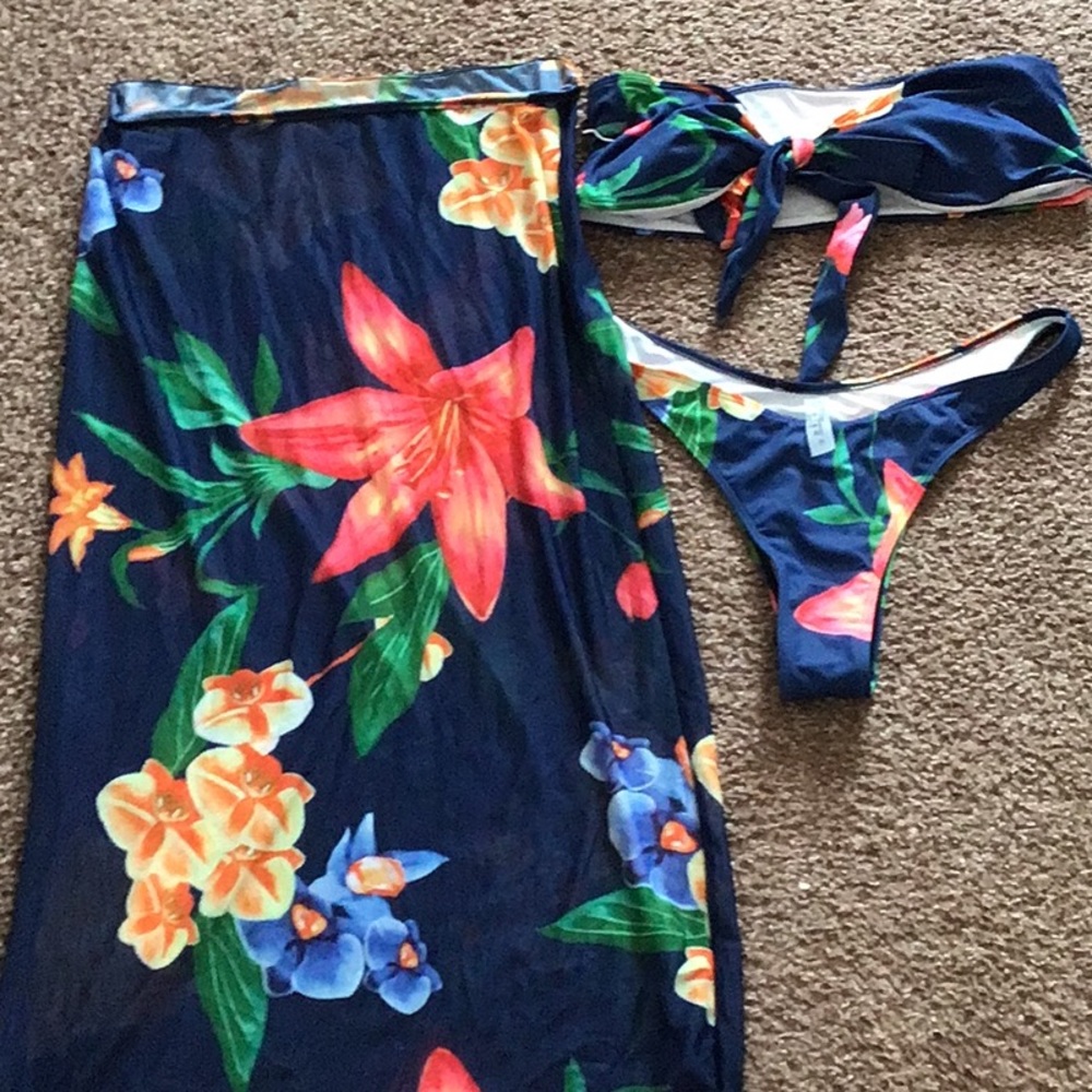 Three piece bikini Blue with flowers on it